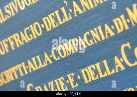 Latin inscriptions on the wall in 'Chiesa dei Santi Gervasio e Protasio Martiri' - Pavia, Italy. November 16 2017. Stock Photo