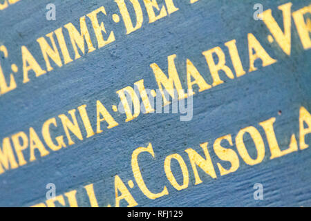 Latin inscriptions on the wall in 'Chiesa dei Santi Gervasio e Protasio Martiri' - Pavia, Italy. November 16 2017. Stock Photo