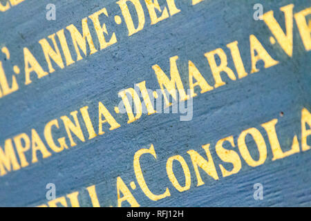 Latin inscriptions on the wall in 'Chiesa dei Santi Gervasio e Protasio Martiri' - Pavia, Italy. November 16 2017. Stock Photo