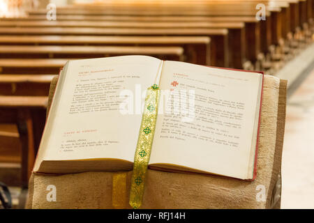An open Bible for the visitors to read today's lecture in the Salesian church "Santa Maria delle Grazie" - Holy Mary of the Grace. Stock Photo