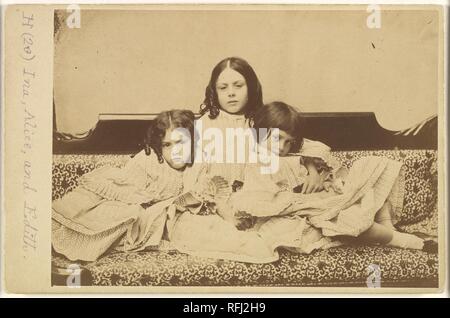 Edith, Ina and Alice Liddell on a Sofa. Artist: Lewis Carroll (British, Daresbury, Cheshire 1832-1898 Guildford). Dimensions: Mount: 4 3/16 in. × 6 7/16 in. (10.7 × 16.3 cm)  Image: 4 1/16 × 6 1/16 in. (10.3 × 15.4 cm). Person in Photograph: Person in photograph Alice Pleasance Liddell (British, 1852-1934); Person in photograph Edith Mary Liddell (British, 1854-1876); Person in photograph Ina Liddell (British, 1849-1930). Date: Summer 1858. Museum: Metropolitan Museum of Art, New York, USA. Stock Photo