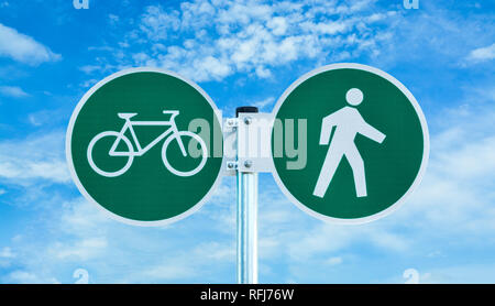 Bicycle and pedestrian shared route sign on cloudy sky background Stock Photo