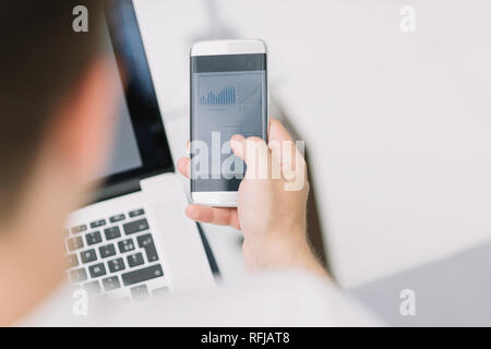 rear view. business men checking financial data Stock Photo