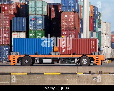 Automated guided vehicle container mover at Port of Rotterdam. Stock Photo