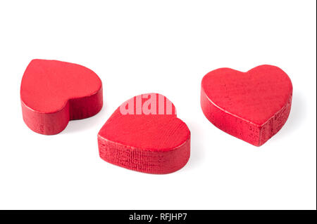 Three red wooden hearts isolated on white Stock Photo