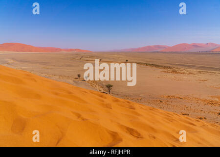 Aerial view of high red dunes located in the Namib Desert in the Namib-Naukluft National Park of Namibia Stock Photo