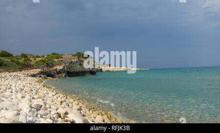 Amazing beach at the Ionian Sea, in the province of Syracuse, Sicily. The beach is part of the Oriented Nature Reserve Cavagrande Stock Photo