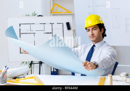Young handsome architect working on the project Stock Photo