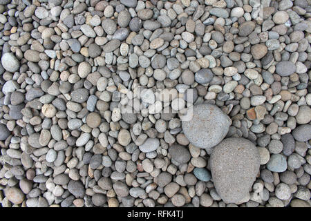 Big stones among smaller pebbles, in the garden. Meditative. Stock Photo