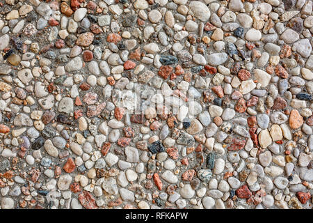 wall of small stones pebbles texture background Stock Photo