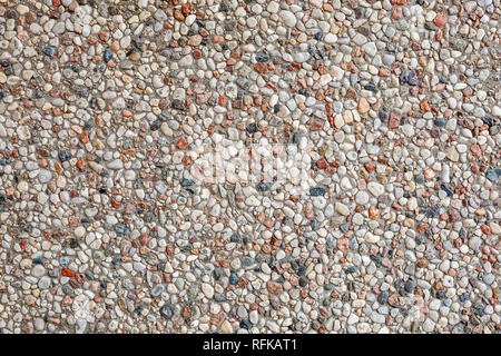 wall of small stones pebbles texture background Stock Photo