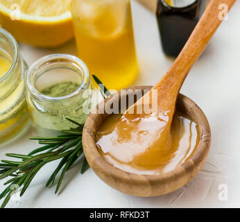 Natural organic spa ingredients with manuka honey, essential oil bottle,  clay powder , bath salt, rosemary branches, natural soap, lemon top view  with Stock Photo - Alamy