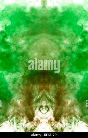 Multicolored pattern of the smoke of the green and orange  colors of the mystical shape on a white isolated background. Abstract pattern in the form o Stock Photo