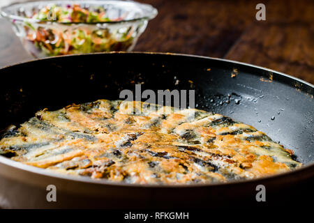 Fresh Fried Sardines / Anchovy Hamsi Tava in Pan on Wooden Surface. Seafood Stock Photo