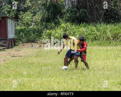 Santa Rita, Peru - Sep 19, 2018: Local people playing football in a small village in the middle of the Amazon Rain Forest, Border of Peru and Brazylia Stock Photo