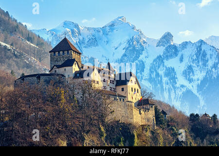 Vaduz Castle, Liechtenstein, winter view with snow covered Alps mountains in background Stock Photo