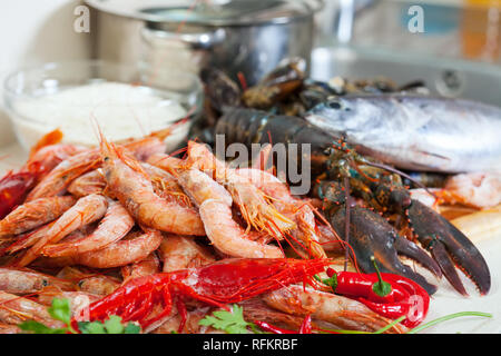 Fresh uncooked sea food specialties and rice ready for cooking Stock Photo