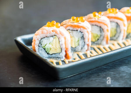 Soft focus on Salmon sushi roll (Japanese food style) - HDR Merge 3 Photos Processing Stock Photo