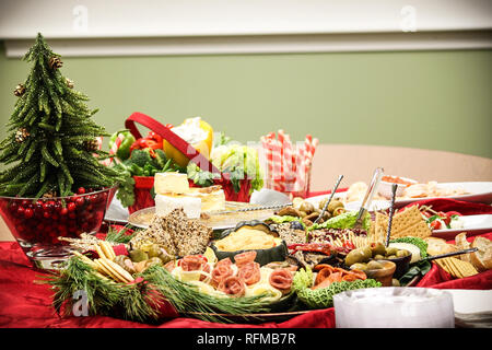 Professionally Catered meat, dips, olives, cheese and crackers in a beautiful display . Holiday office party. Stock Photo