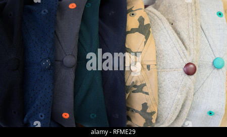 Top view of different snap back baseball caps with different textures. Summer street wear head caps Stock Photo