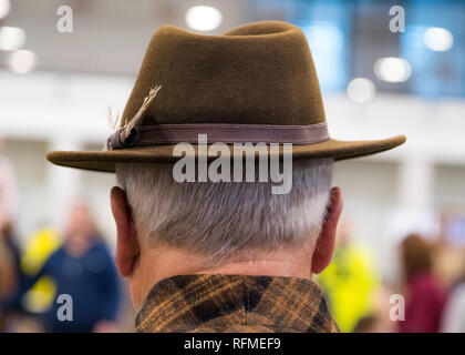 Cowboy couture. Portrait of older man wearing cowboy hat from behind Stock Photo