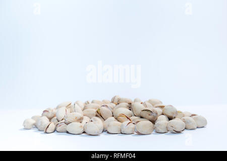 Pistachios nuts on white background with space for type. Food mix background, top view, copy space, banner Stock Photo