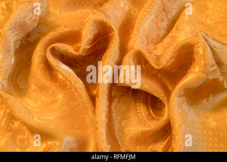 Love symbol, heat shaped lights on golden colour background Stock Photo