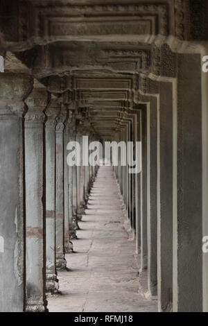 Long, seemingly endless corridor between the outside and inside of the main, central building at the Angkor Wat complex in Siem Reap, Cambodia. Stock Photo