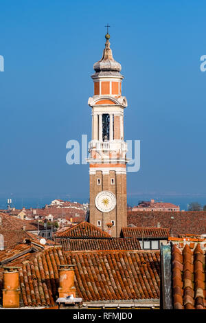 Aerial view on the church Chiesa Cattolica Parrocchiale dei Santi Apostoli across the roofs of the so-called 'Floating city' from Fondaco dei Tedeschi Stock Photo