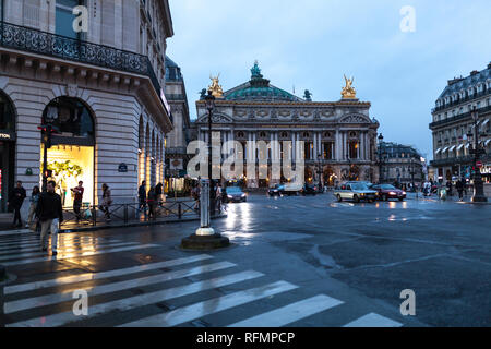 Paris, France 01 June 2018 Traffic cars in front of Opera, Paris. The Palais Garnier is a 1,979-seat opera house, which was built from 1861 to 1875 fo Stock Photo