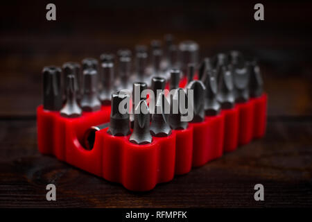 collection of screwdriver bits in red stand Stock Photo