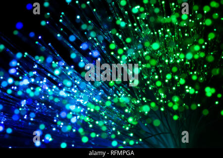 bundle of optic fibers in blue and green light Stock Photo