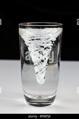 vortex whirlpool in glass of water Stock Photo