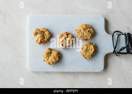 Homemade Salty Yogurt Cookies with Rolled Oats / Salted Pastries on Marble Board. Organic Food. Stock Photo