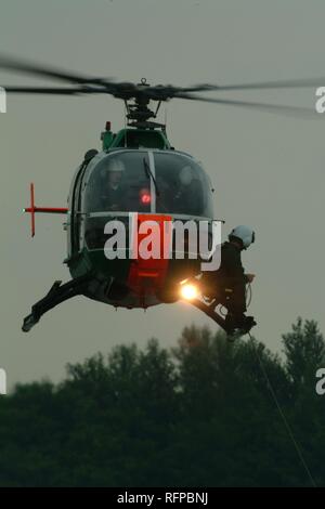 DEU, Germany, Duesseldorf: Rescue exercise, saving of people out of rivers or lakes. Police flying squad. Police helicopters. Stock Photo