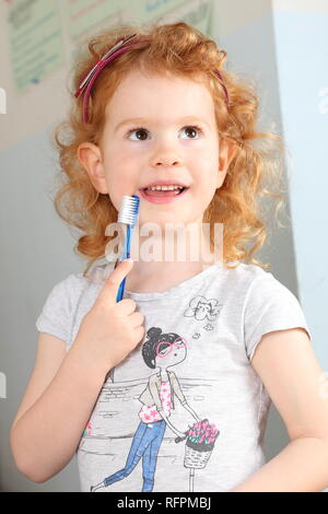 Happy Girl with toothbrush Stock Photo