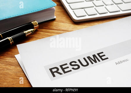 Resume on a desk. Recruiting and hiring. Looking for the job. Stock Photo
