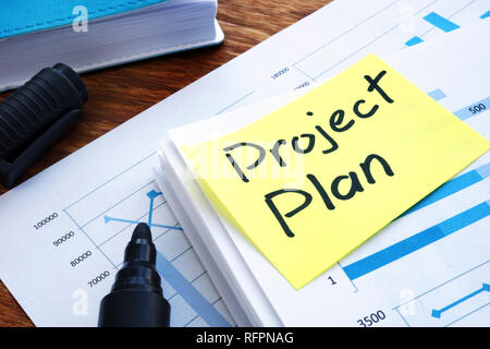 Project Plan and business papers on a desk. Stock Photo