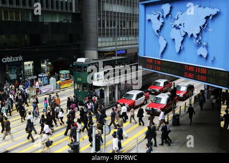 Pedestrian crossing, display with stock exchange informations, De Voeux Road, Hong Kong Island, China Stock Photo