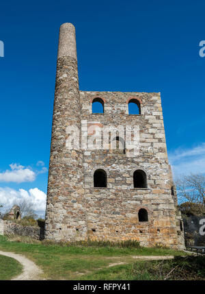 Cornish engine house under a beautiful blue sky with white clouds in background Cornwall UK Europe Stock Photo