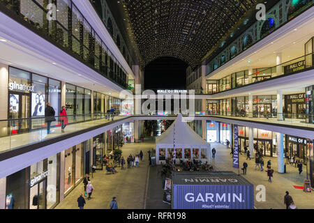 BERLIN, GERMANY - NOVEMBER 13, 2018: Unrecognized people visit Mall of Berlin. Berlin is the capital and German largest city by both area and populati
