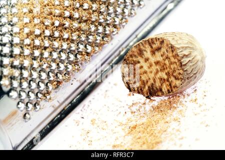 Nutmeg with grater Stock Photo