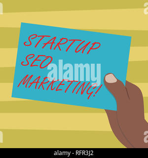Text sign showing Startup Seo Marketing. Conceptual photo Attract qualified leads while your work improving Drawn Hu analysis Hand Holding Presenting  Stock Photo