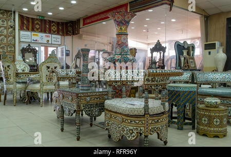 Interior of Madaba Art and Handicraft Centre with mother of pearl inlay woodwork and furniture in shop display, Jordan, Middle East Stock Photo