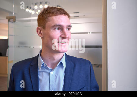 Mature European man with red hair in the office Stock Photo