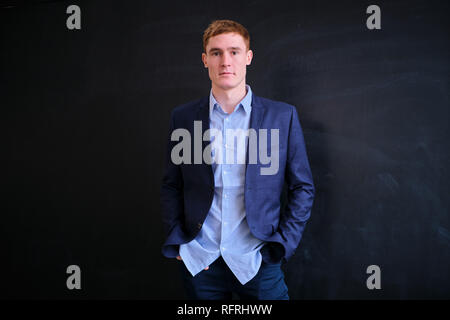 Mature European man with red hair on a black background Stock Photo