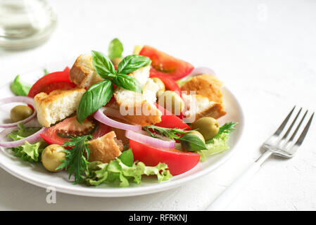 Panzanella Tomato Salad with cherry tomatoes, basil and ciabatta croutons. Summer healthy food - panzanella salad, copy space. Stock Photo