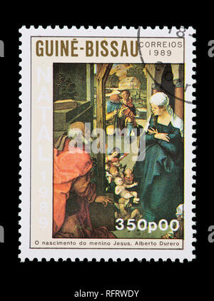 Postage stamp from Guinea-Bissau depicting the Durer painting of the Madonna and Child. Stock Photo