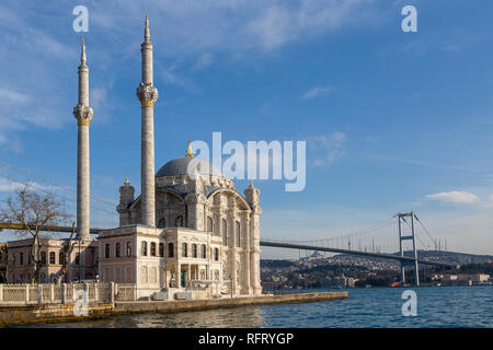 Ortakoy Mosque known also as Mecidiye Mosque, with Bosphorus Bridge connecting Europe to Asia, in the background, in Istanbul, Turkey Stock Photo