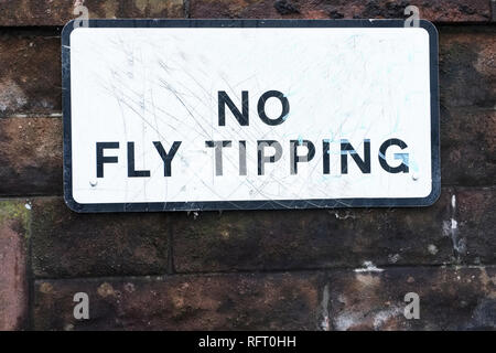 No fly tipping sign on council estate wall Stock Photo